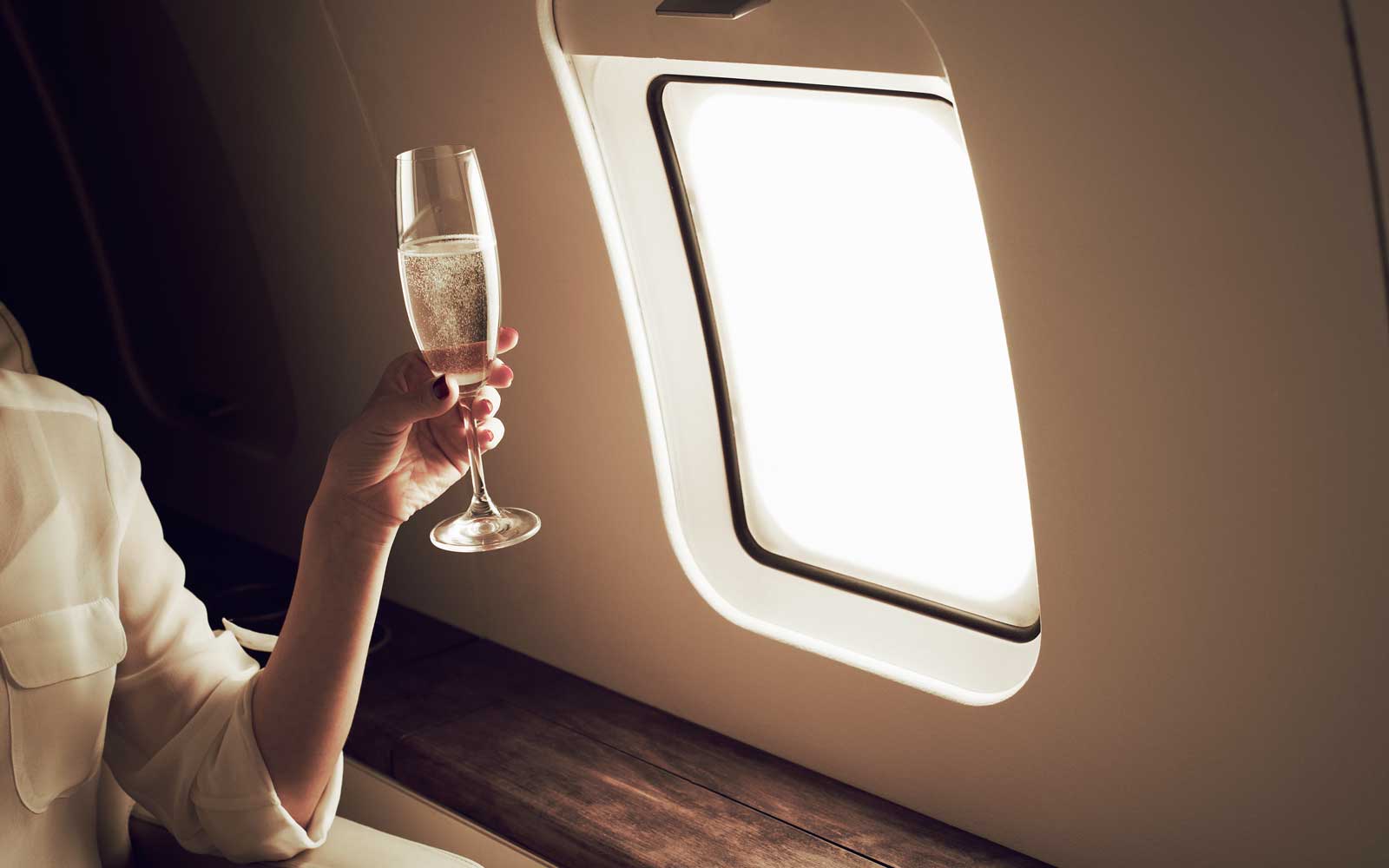 Businesswoman relaxing aboard private jet