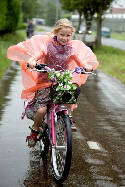 stock-photo-girl-cycling-in-the-rain